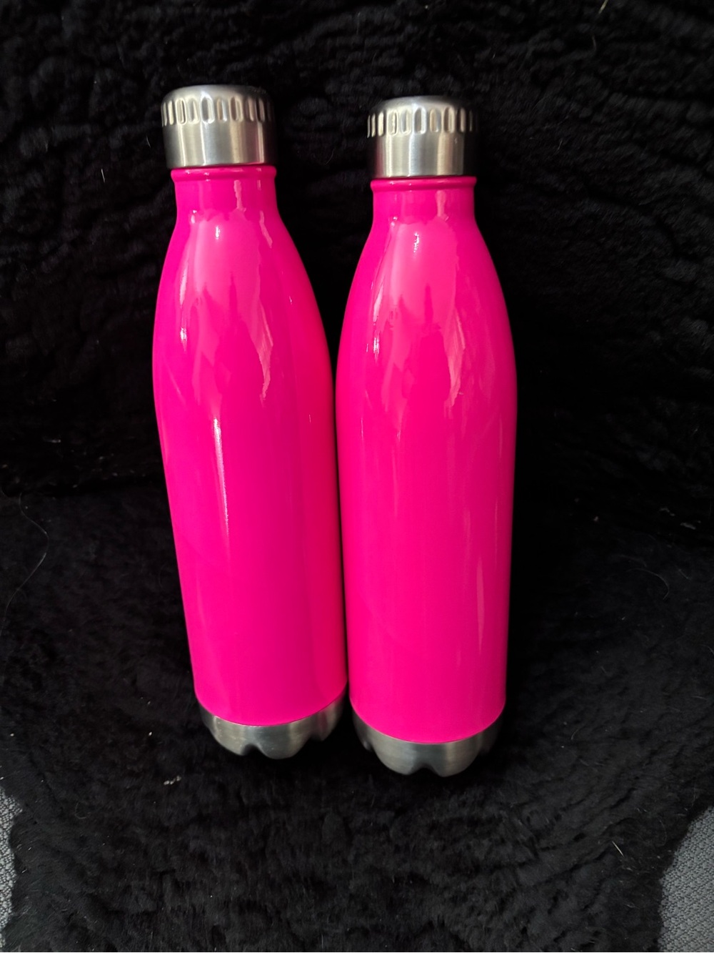 Bundle 2 count neon pink water bottles.